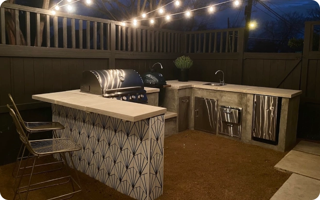 Outdoor kitchen space custom-designed and built by J&L Hardscapes.